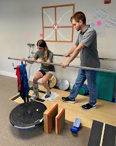 Patient working with a provider at a physical therapy clinic in Fredericksburg, VA