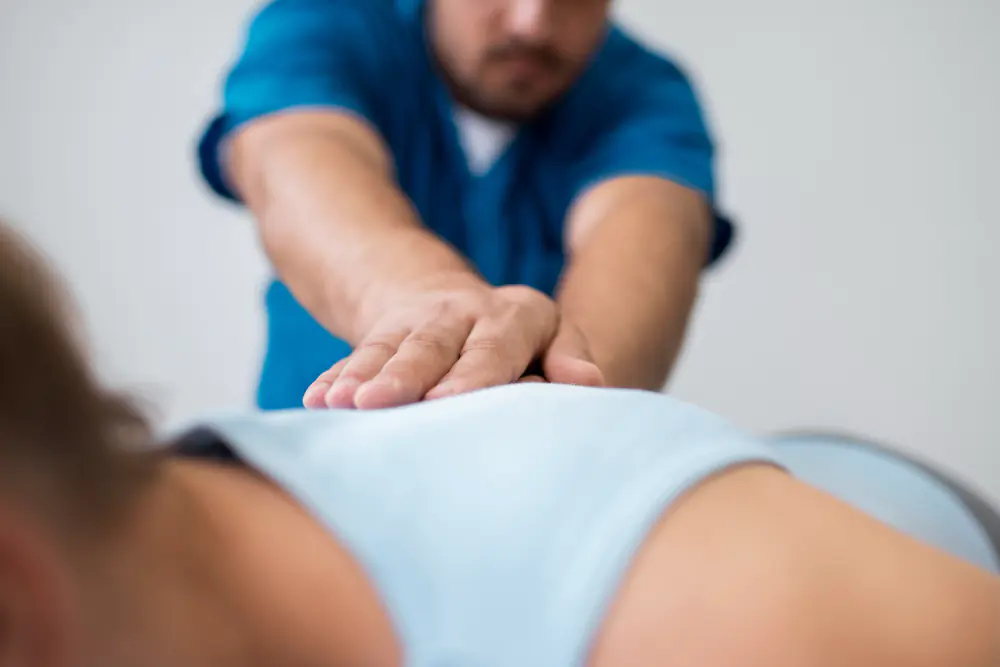 Physical therapist performing manual therapy on a patient with lower back pain at Fusion Rehab and Wellness in Alexandria, VA