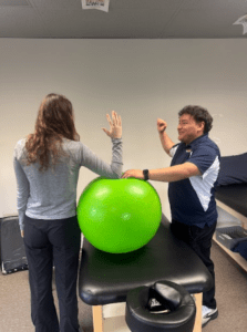 Patient working with a provider at a sports physical therapy clinic in Fredericksburg, VA
