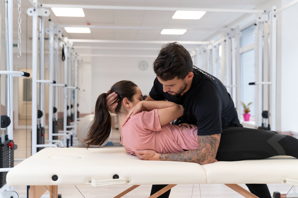 Dr. Kimberly Tyborowski, pelvic health specialist at Fusion Rehab and Wellness Alexandria, reviewing a personalized menopause physical therapy treatment plan with a female patient